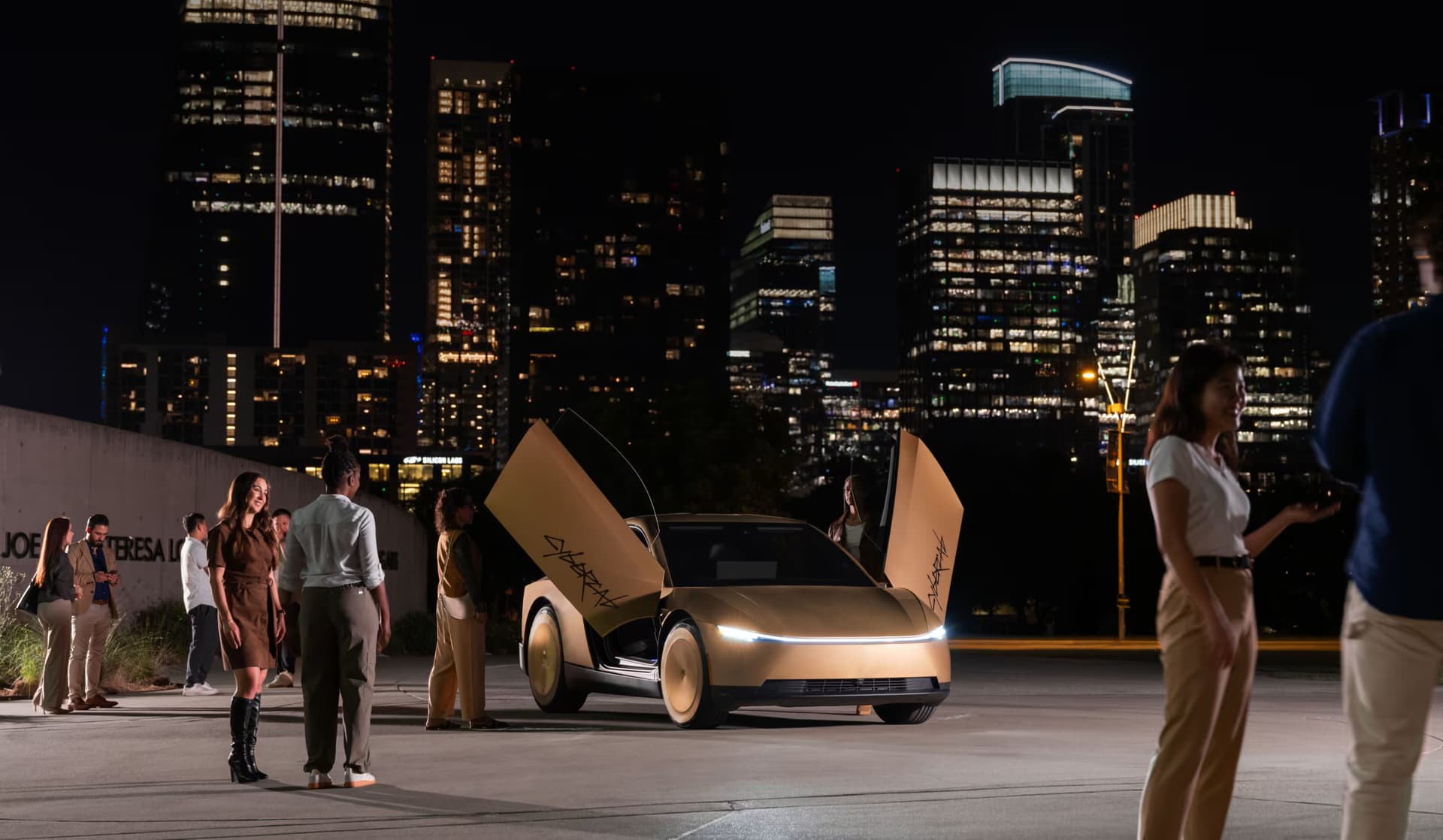 A gold Tesla Cybercab with both doors raised, surrounded by people in a city at night.