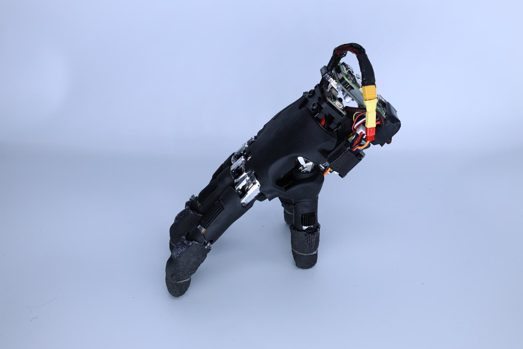 ETH Zurich's self-supported robotic hand stands on its fingertips, with electronics mounted above the palm.